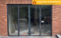 Раздвижная алюминиевая дверь для бутика с панорамным остеклением и автоматическим открыванием
