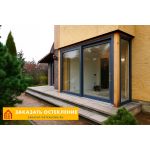 Веранда дома с цветным панорамным остеклением