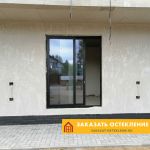 Портальные двери черного цвета из теплого алюминия для частного дома