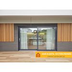 Серые портальные двери для бассейна с панорамным остеклением в пол