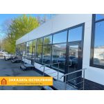 Распашная входная группа для магазина с дверью и окнами черного цвета