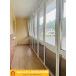 Теплое панорамное остекление балкона в квартире с энергосберегающими стеклопакетами