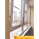 Теплая лоджия с панорамным остеклением профилем белого цвета