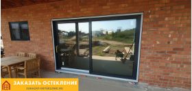 Терраса дома с панорамным раздвижным остеклением