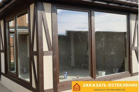 Раздвижное ламинированное окно коричневого цвета