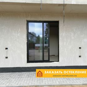 Портальные двери черного цвета из теплого алюминия для частного дома