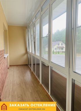 Теплое панорамное остекление балкона в квартире с энергосберегающими стеклопакетами